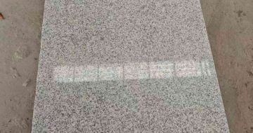 唐山芝麻白光面毛板