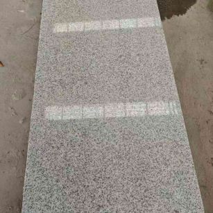 唐山芝麻白光面毛板